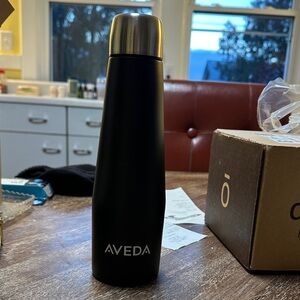 AVEDA Black and Silver Bottle
